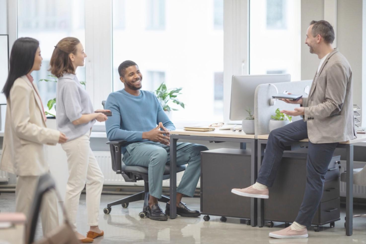 Business mentoring session with laptop and documents on conference table